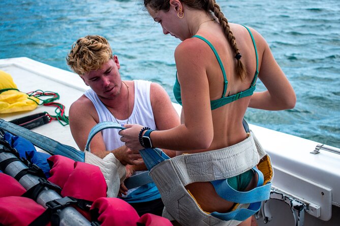 Aruba Parasailing Experience from Noord - Getting fitted for the parasail