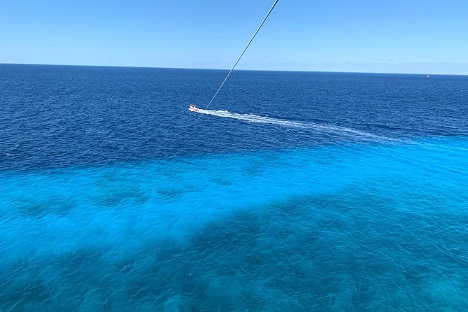 Best Parasailing Cozumel + Locker - Landing back on the boat