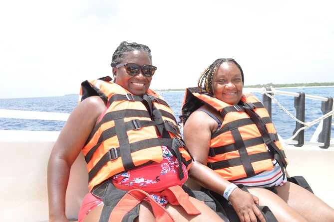 Best Parasailing Cozumel + Locker - Getting ready with a harness and life jacket