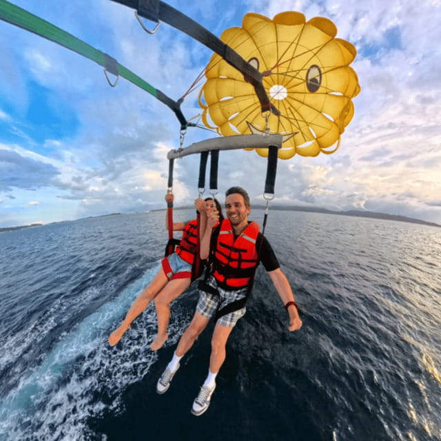 Boracay: Island Hopping with Lunch and Parasailing - Guide support and the human side of the day