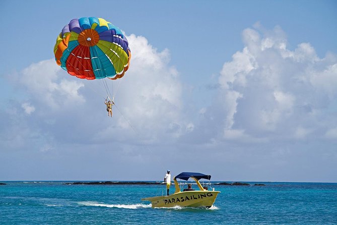 Catamaran to Ile aux Cerf with Parasailing, Tube Riding & Lunch - Ile aux Cerfs: beach time with a dose of speed