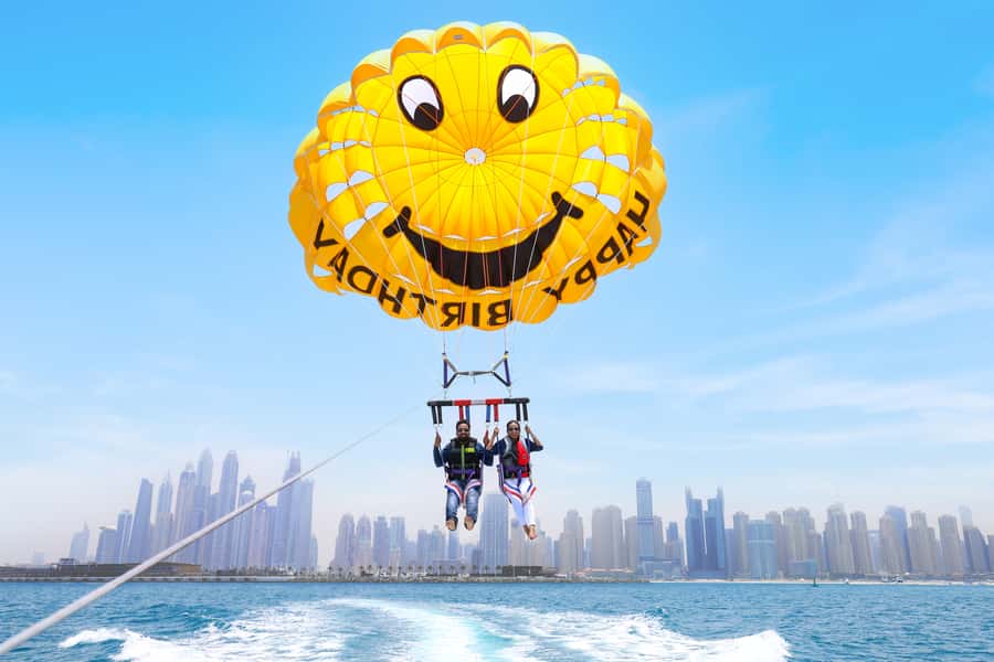 Dubai: Parasailing with Happy birthday Parachute JBR & Palm - Safety Gear and the Boat Ride Before Takeoff