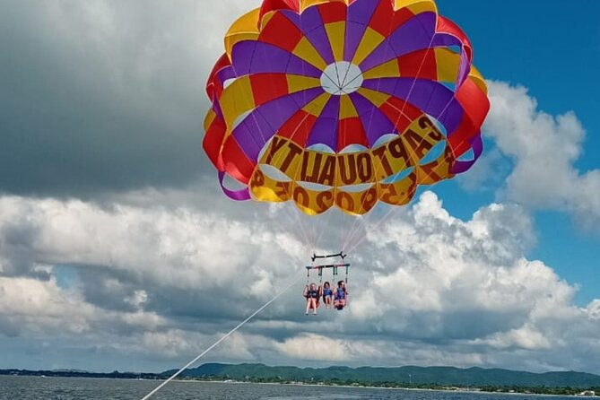 Negrils Seven Miles Beach, Rick's cafe and Parasailing Tour. - Parasailing above Negril