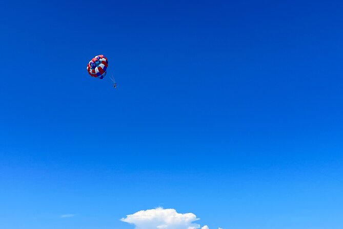 Parasailing above Turquoise Ocean Waters in Montego Bay - Beach time after you come down