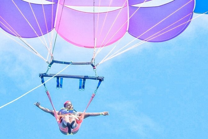 Parasailing, Blue Hole Mineral Spring, Seven Mile Beach - Who will enjoy this day most