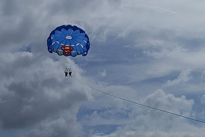 Parasailing, Blue Hole Mineral Spring, Seven Mile Beach - Parasailing above Seven Mile Beach