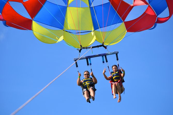 Punta Cana Party Cruise with Snorkeling, Hooka Diving and Parasailing - Parasailing above the Caribbean water