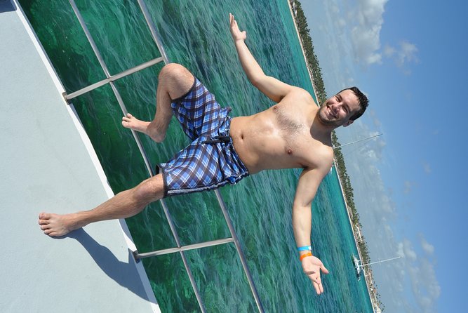 Snorkeling Catamaran Tour & Parasailing - Fruit, drinks, music, and the natural pool